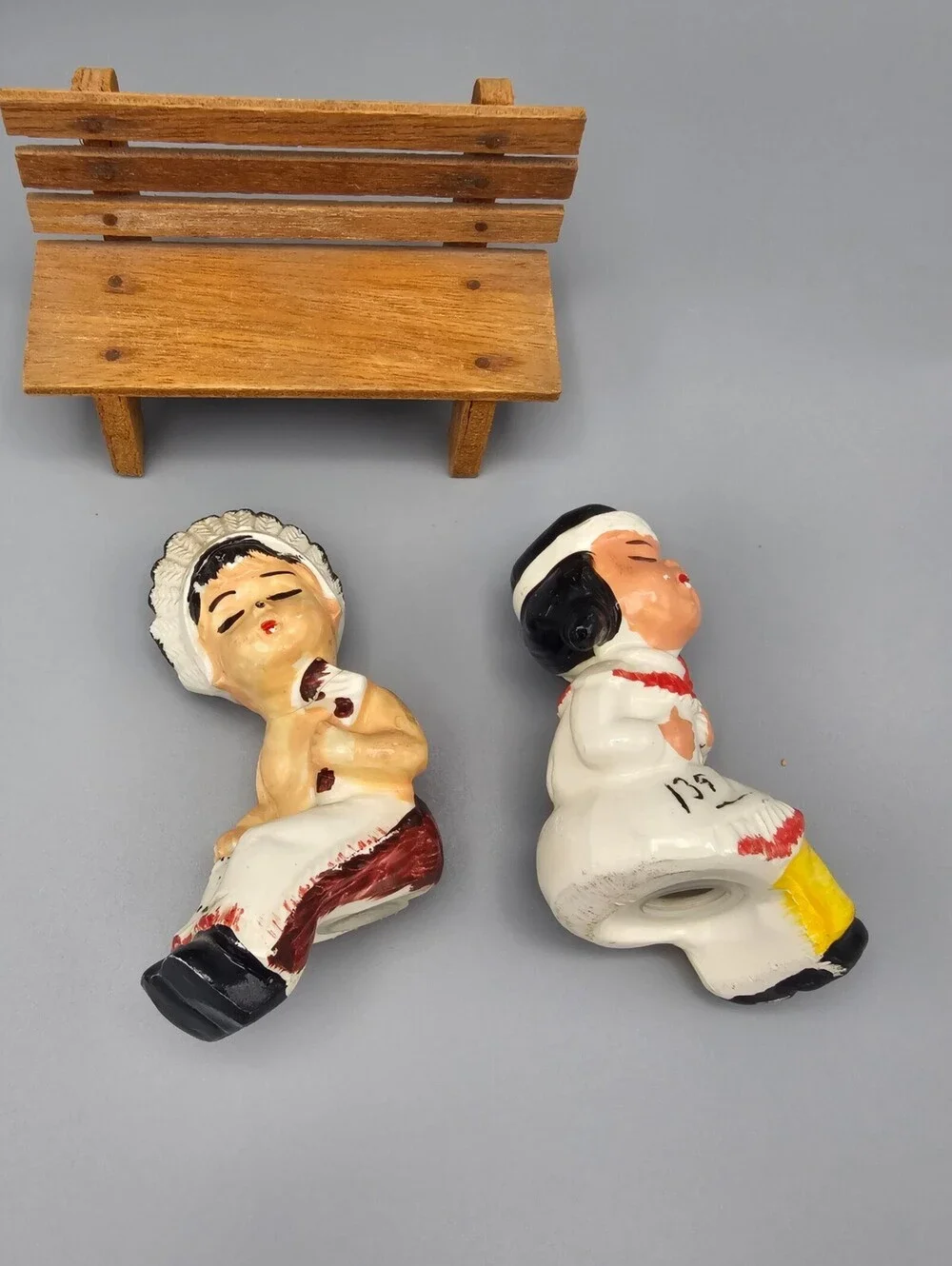 Vintage Ceramic Native American Couple Salt and Pepper Shakers on Wooden Bench